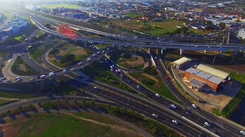 Aerial View of Highway Interchange Traffic During Daytime