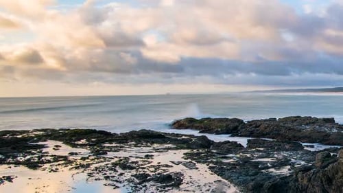 Sunset Colors with Fast Clouds over Ccean Coastline