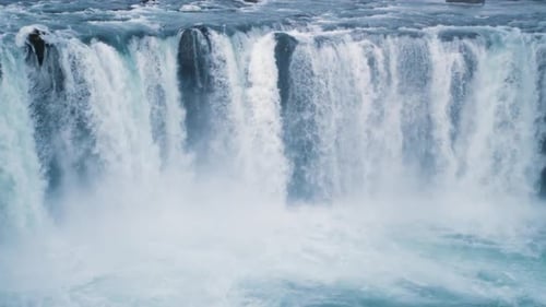 Beautiful Waterfall Rushing Down the Rocks