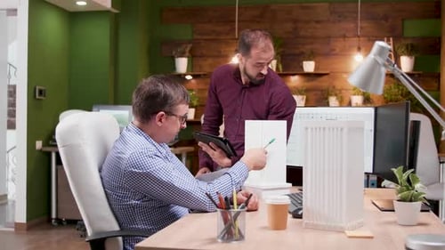 Team of Architects in the Office Having a Conversation