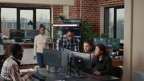 Software Engineers Brainstorming Ideas Looking at Code on Computer Screens Asking Feedback