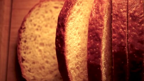 Fresh, homemade sliced bread on cutting board, Close Up Pan