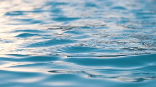 Closeup Seascape Surface of Blue Sea Water with Small Ripple Waves
