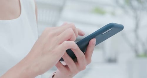 Woman Using Mobile Phone, Close Up