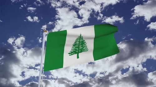 Norfolk Island Flag Waving in the Wind Against Blue Sky