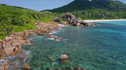 Aerial Drone View of Typical Granite Boulders and Tropical Coastline at La Digue Island Seychelles