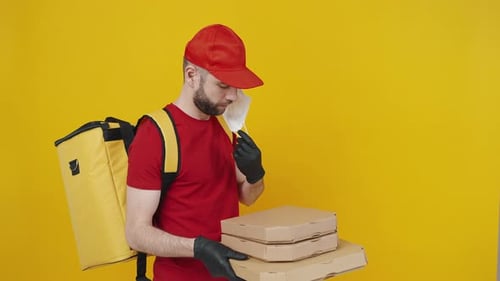 Pizza Delivery with Mask on Yellow Background