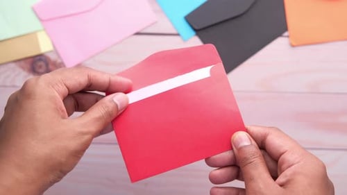 Close Up of Man Hand Reading a Thank You Letter