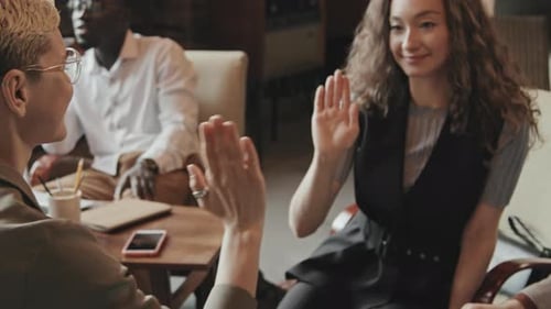 Team Celebration: Group High Five in the Office