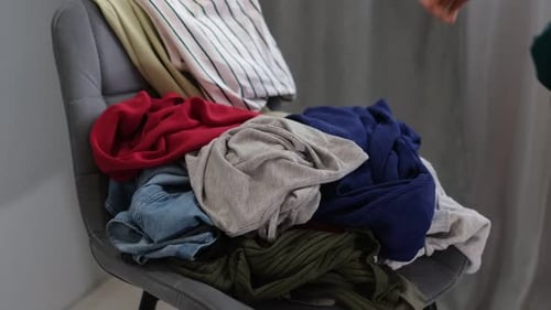 Pile of Colorful Clothing Picked Up From Chair