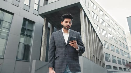 Businessman Stand in the City Center Street Uses Phone Texting Scrolling Tapping