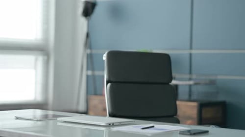 African Businessman Coming Back Opening Laptop in Office