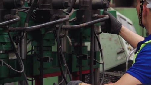 Smart Factory Worker Using Machine in Factory Workshop