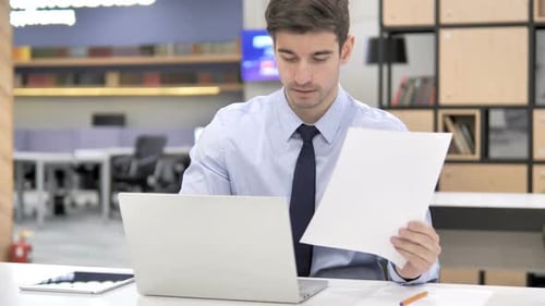Business Paperwork in Office By Businessman