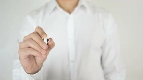 Man Writes Word 'Action' on Transparent Surface