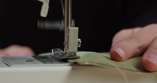 Dressmaker Working on Sewing Machine Closeup