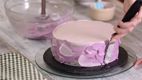 Decorating a Cake with Purple Frosting