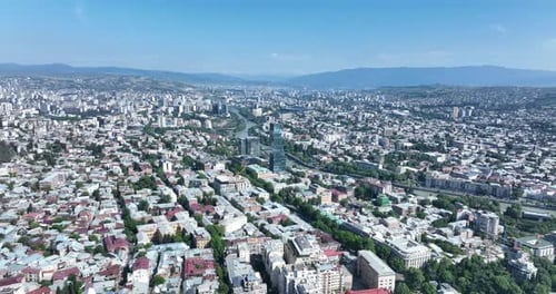 Tbilisi, Georgia - June 7 2022: Flying over kura river in the center of Tbilisi city
