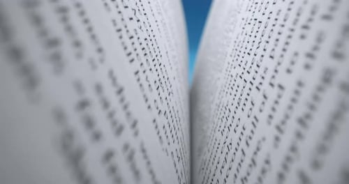 Close Up of Book Pages with Blue Background