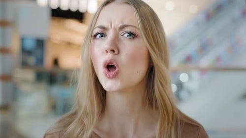 Confused Woman Frowning in Close Up Portrait