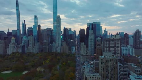 Forwards Fly Along Autumn Central Park at Dusk