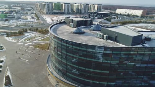 Vshaped Business Center and Snowy Lawns on Suburb Site