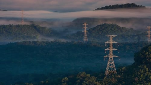 Aerial view high voltage power transmission towers.