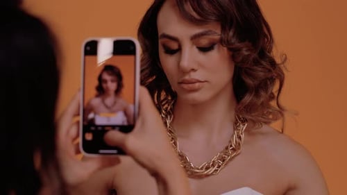 Model Posing for a Photo with Bold Jewelry