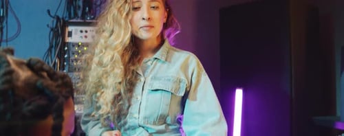 Multiethnic Duo Singing to Guitar in Recording Studio