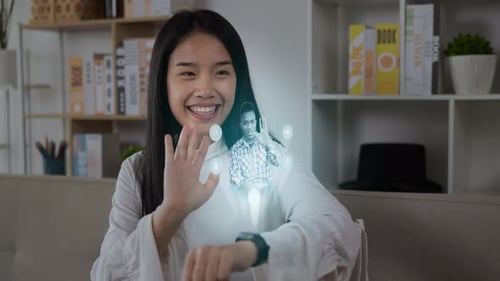 Young Adult Video Chatting with Smartwatch Hologram