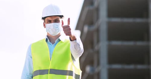 Construction Worker Gives Thumbs Up on Building Site