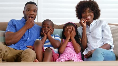Family Watches a Scary Movie at Home