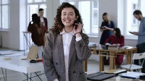 Smiling Woman in Modern Office Environment