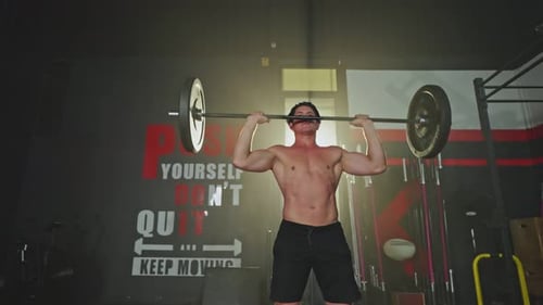 Caucasian young male athlete or sportsman shirtless, exercise to maintain muscle infitness or gym.