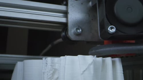 3D Printer Printing Sculpture in Workshop