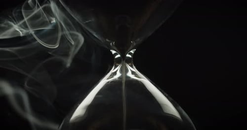 Hourglass with Smoke on Black Background