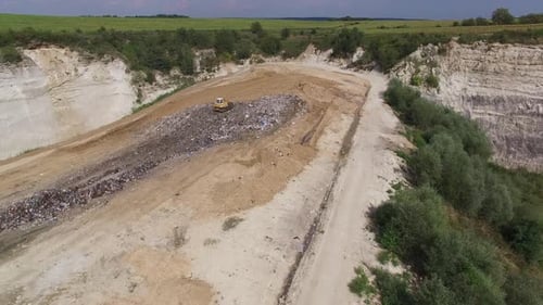 Bulldozer at Work on Landfill Aerial View