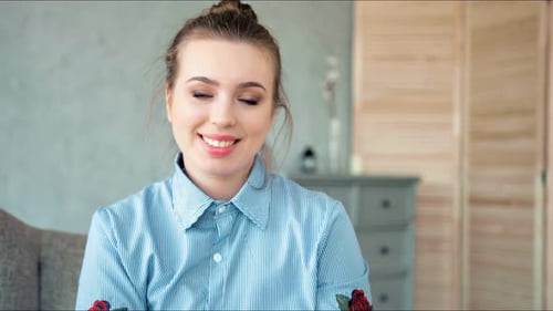 Smiling Woman Portrait Indoors Looking at Camera
