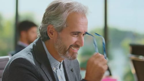 Smiling man taking short rest from work
