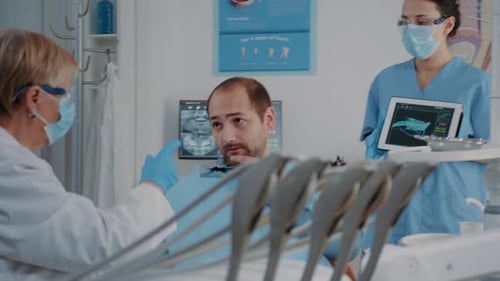 Dentist Reviewing X-Rays with Patient