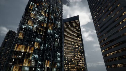 Edificios de oficinas de rascacielos de cristal con cielo oscuro