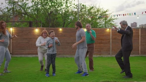 Happy Family Celebrating Party. Dancing and Enjoying Celebration.