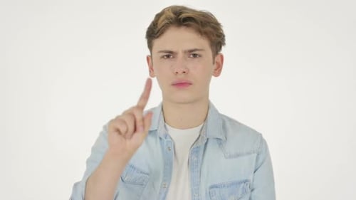 Young Man Showing No Sign By Finger on White Background