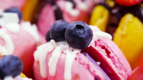 Handmade Beautiful Macaroon Sweet Food Dessert with Fresh Strawberries and Blueberries Decorated