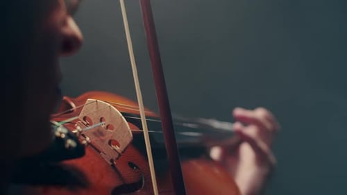 Close-Up of Violin Playing with Bow