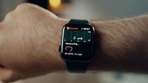 Smartwatch Displaying Heart Rate on Arm