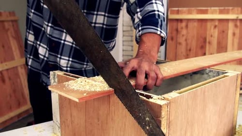 Carpenter Working on Wood Craft at Workshop