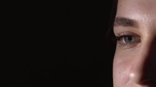 Woman's Face Close Up in Dark Studio