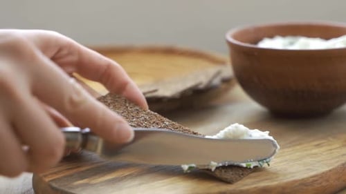 Close Up Shot the Cook Spreads Butter By Knife on Crispy Roasted Toast Bread Making the Sandwich