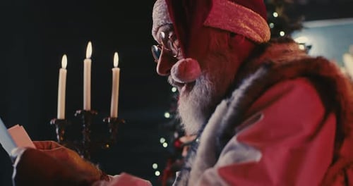 Santa Claus Reading Letters by Candelight